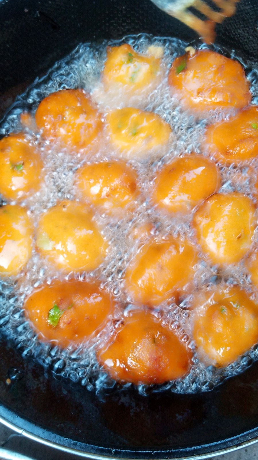 Food frying in hot oil in a skillet