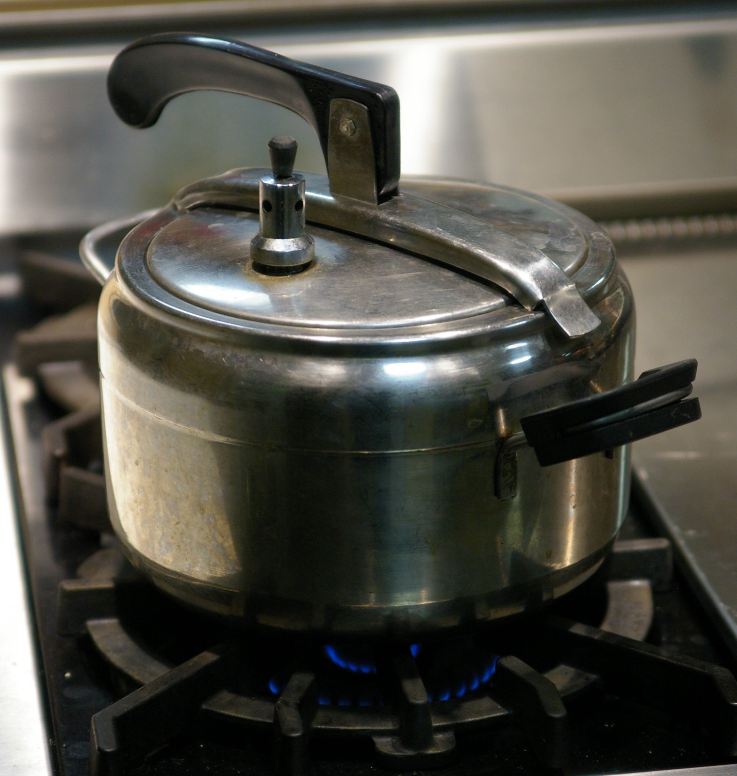 A stovetop pressure cooker at work