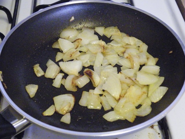 Onions softening in a hot pan