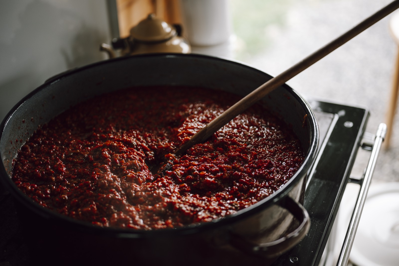 Tomato sauce simmering in a pot
