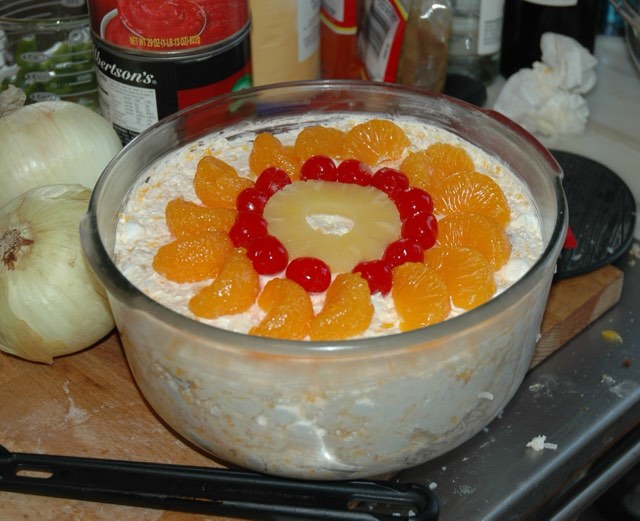 A molded creamy fruit gelatin salad