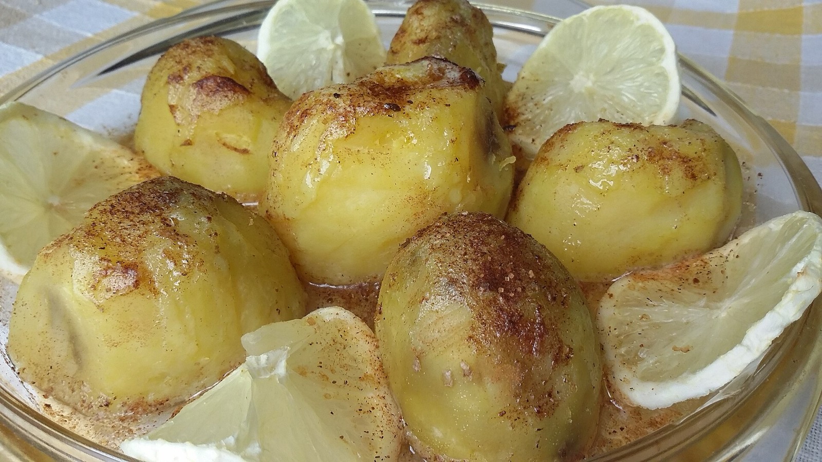 Candied sweet potatoes glazed in a baking dish